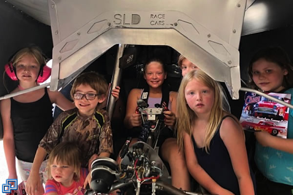 Future Jr. Dragster pilot Ashley, climbed into the driver's seat of our funny car while her siblings and cousins joined her for a photo op. 