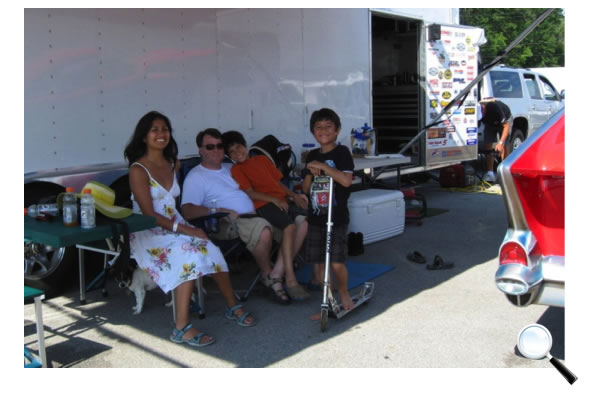 Crissy & Derek, with grandsons Isaiah and DJ, and their dog Moby, hanging out in our pits